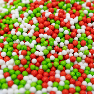 Close up of CakeFetti Jingle Dots Christmas sprinkles, showing texture and colours